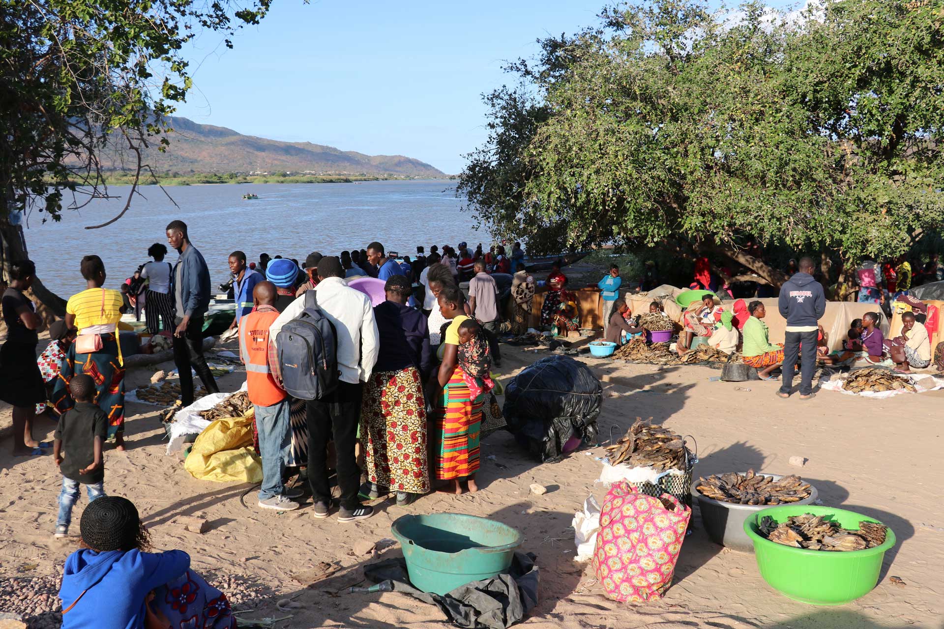 Fish traders gather outside the main harbor in Luangwa. Photo by Agness Chileya