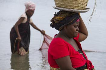 Fisher women catching small shrimp and fish in Bagamoyo, Tanzania. Photo by Samuel Stacey.