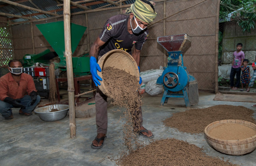 Producing fish feed in a factory, Jessore, Bangladesh. Photo by Yousuf Tushar.