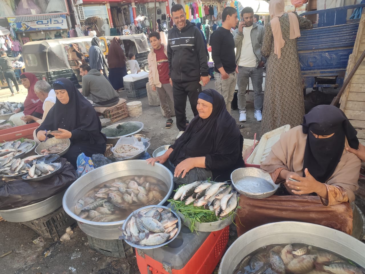 A group of women fish vendors seliing fish at a local market in Shakshouk village, Fayoum, Egypt. Photo by Photo by Mahmoud Rashad, research assistant, WorldFish – Egypt.