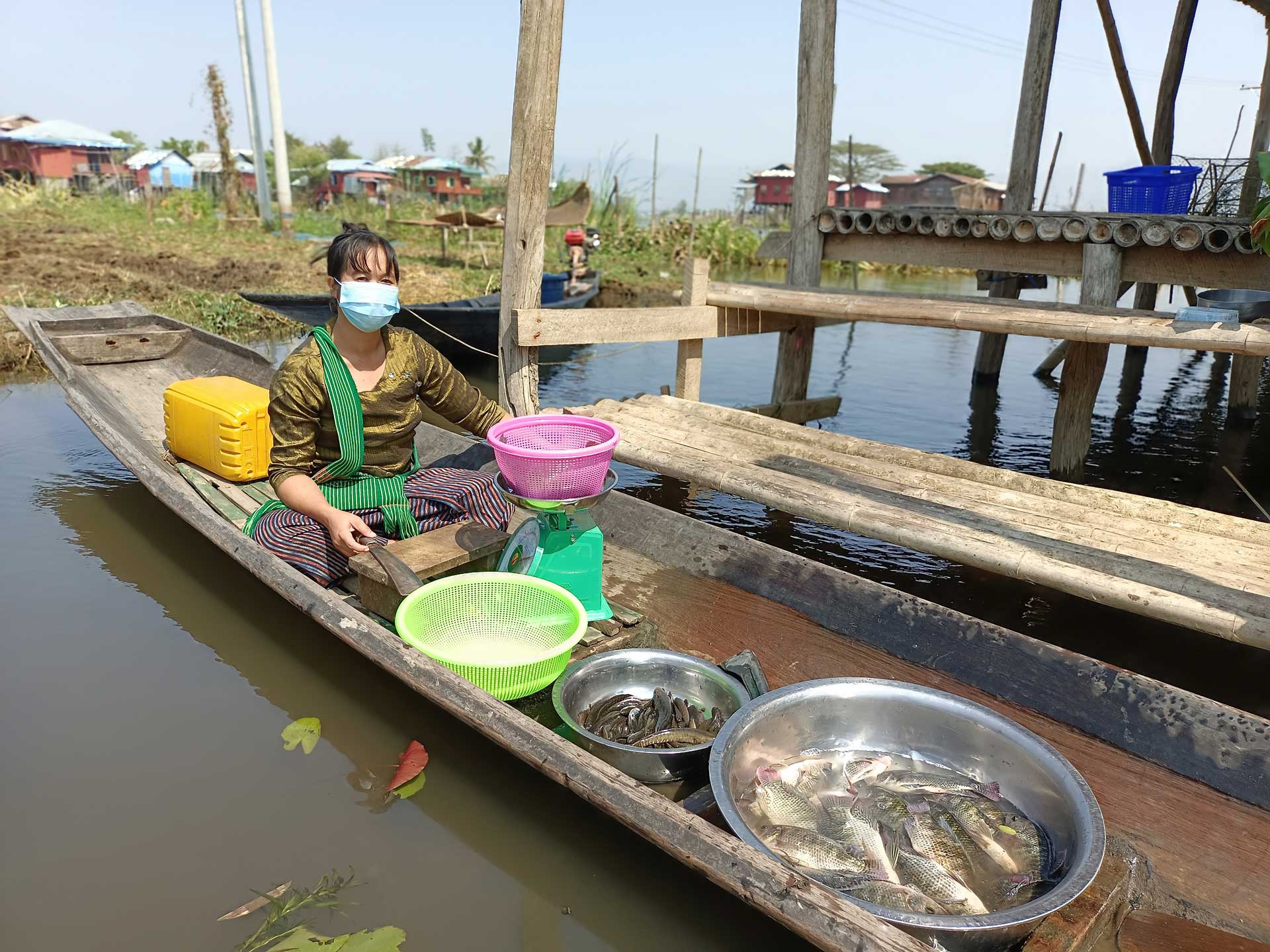 Daw Lae Lae Soe poses with her fish. Photo by Kyaw Moe Oo.
