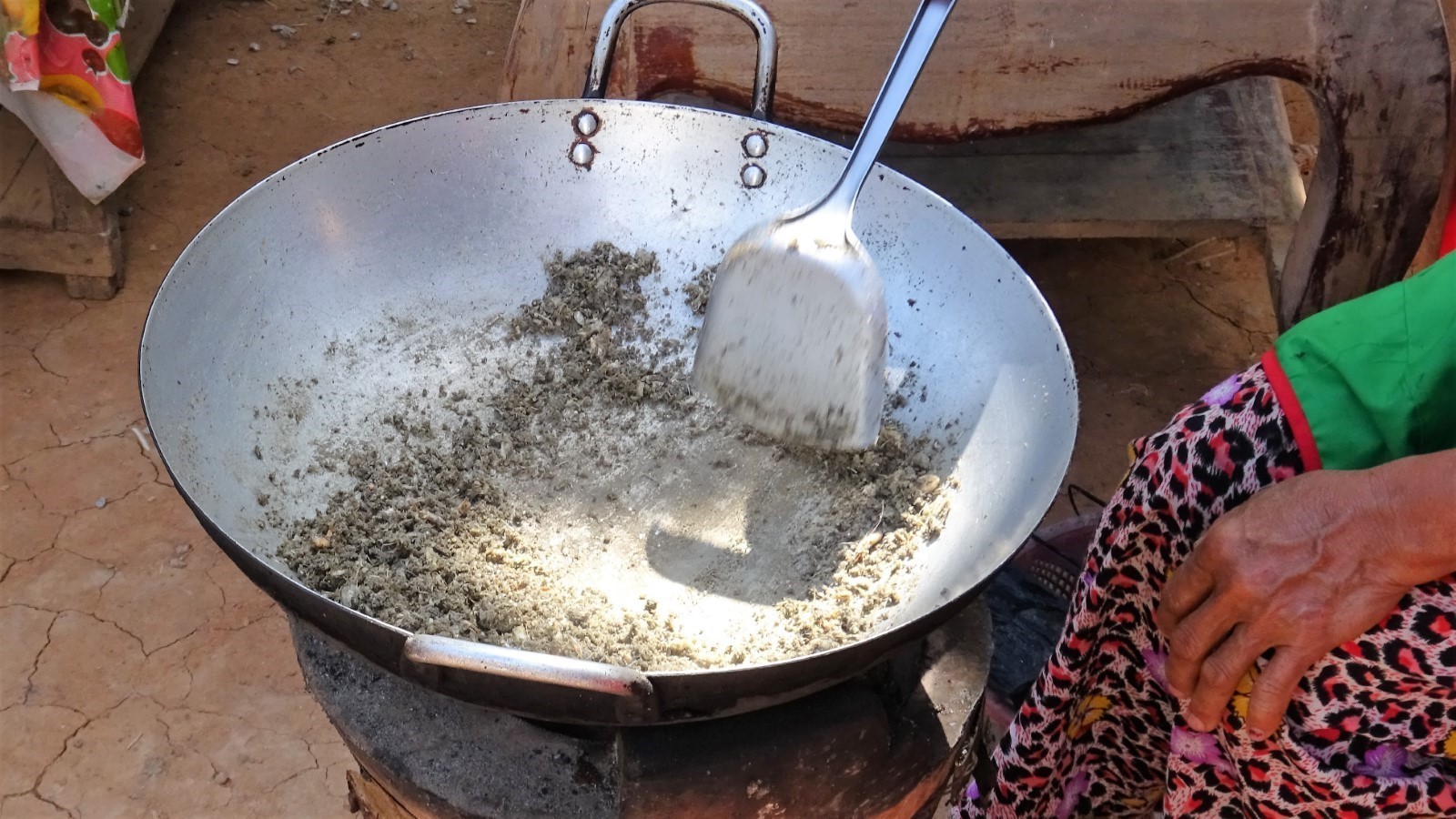 Producing the dried fish powder using small indigenous mola fish. Photo by Michael Akester.