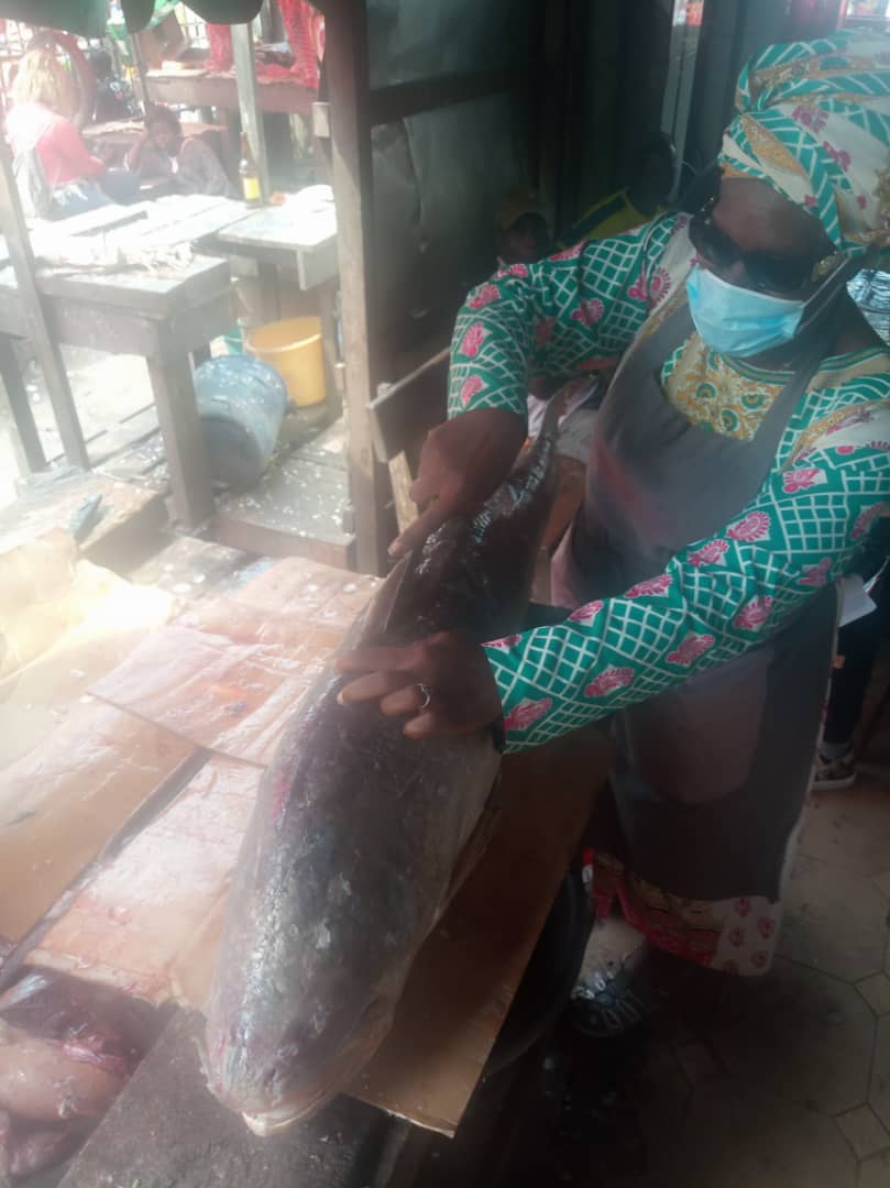 Fishmonger Bayene Ateba guts fish in preparation for the market. Photo supplied by Bayene Ateba.