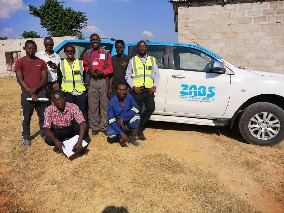 Intern Francis Banda (right) poses with the Zambian Bureau of Standards.