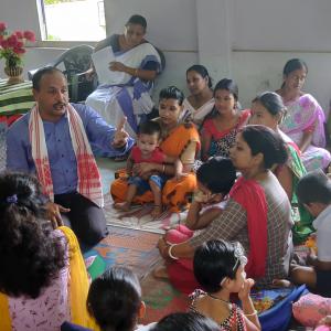 Participants learn about the nutritional benefits of small fish and how simple household practices can improve family diets during a community event in Assam.