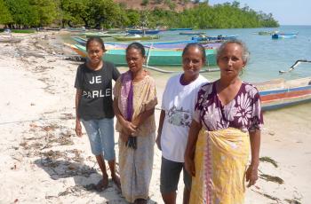 Women play a critical role in aquatic food supply chains, though they typically perform informal postharvest activities like fish processing and trade, so their contributions are persistently undervalued. Photo by Kate Bevitt.
