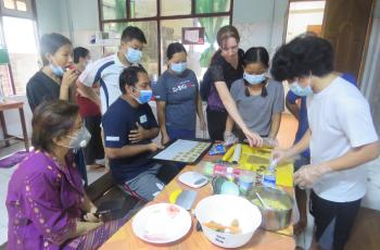 Youth prepare nutritious biscuits using FedWell’s dried small fish powder. Photo by Thomas Tha Thaw. 