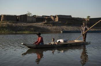 Boats transporting people at Mongu harbour, Zambia. Photo by Anna Fawcus.