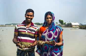 Nehar and his wife happy with their production in shrimp farming. Photo by A.w.m Anisuzzaman.