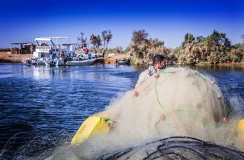 Fisherman on his boat leaving one of the fishing camps in Lake Nasser. Photo by Sara Fouad.