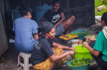 Women preparing vegetables and other foods in Timor-Leste. Photo by Shandy Santos.