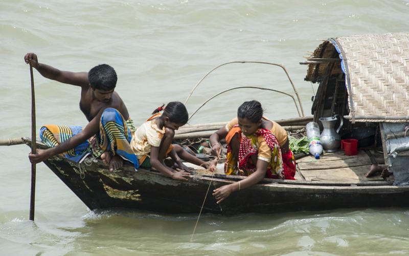 A family fishes in Chandpur, Bangladesh. Photo by Finn Thilsted.
