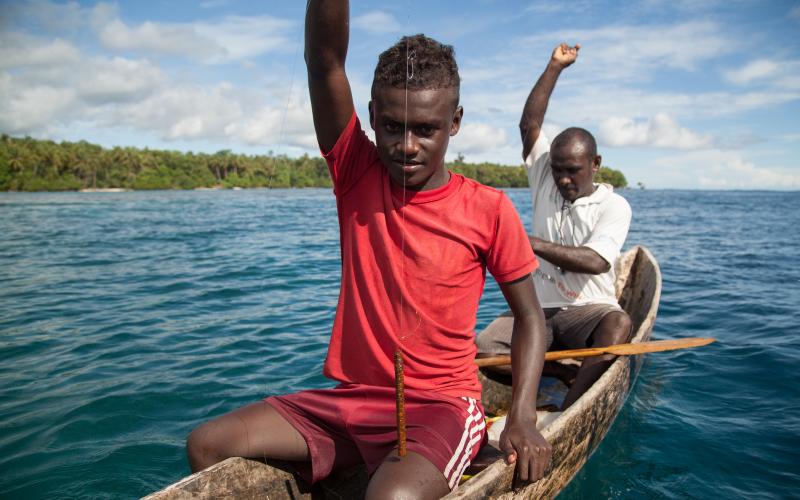 Men prepare to drop their fishing lines, Santupaele village, Western Province, Solomon Islands. Photo by Filip Milovac.