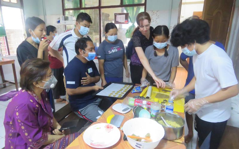 Youth prepare nutritious biscuits using FedWell’s dried small fish powder. Photo by Thomas Tha Thaw.