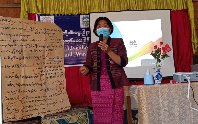 Daw Khin Soe Win, the Group Leader of Early Childhood Care and Development, speaks on the nutritional benefits of small fish.  