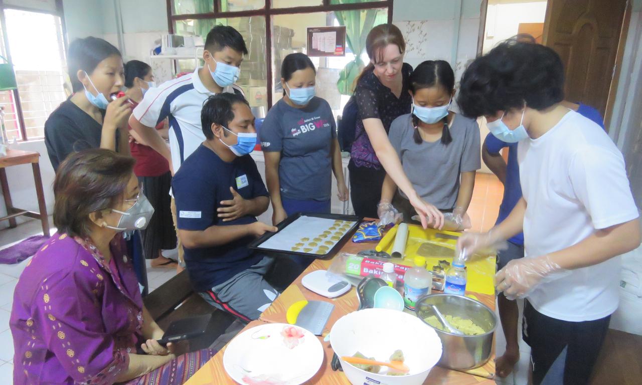 Youth prepare nutritious biscuits using FedWell’s dried small fish powder. Photo by Thomas Tha Thaw.
